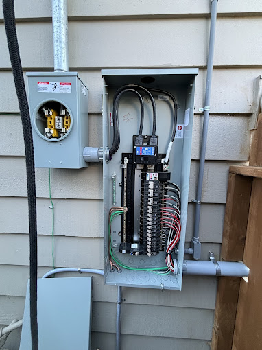 An electrical box with wires attached to it