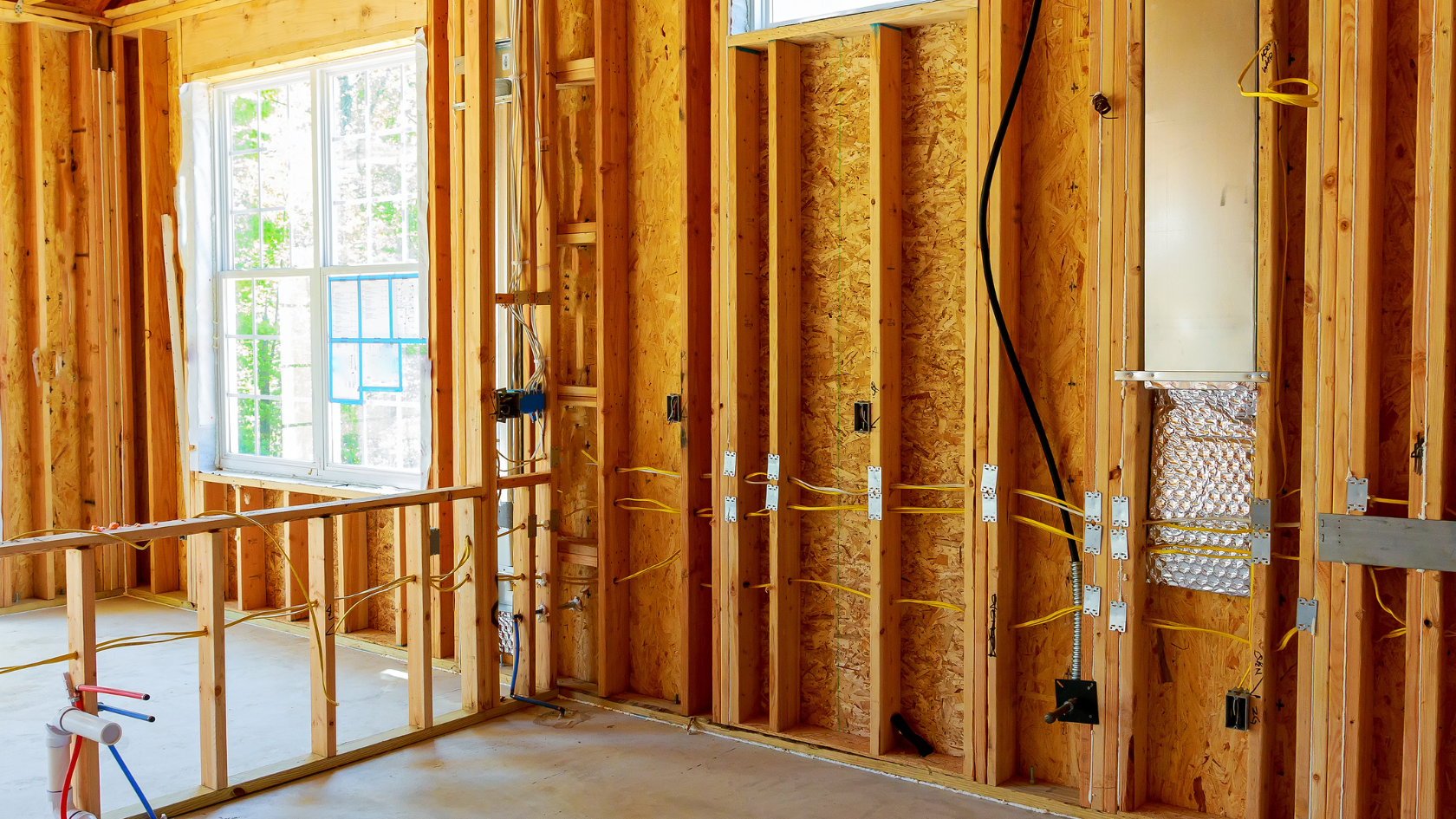 A room that is under construction with a lot of wood